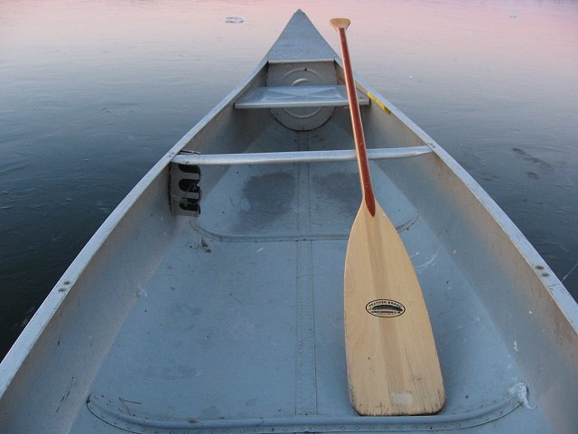 Canoe and paddle on frozen Upper South Long Lake, Brainerd, Minnesota