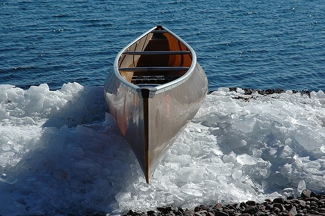 We-no-nah canoe on Lake Superior icy shore, Duluth, Minnesota